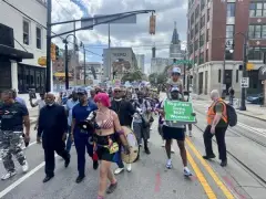 Demonstrators rally across Georgia for ‘Good Trouble Day’ in honor of John Lewis
